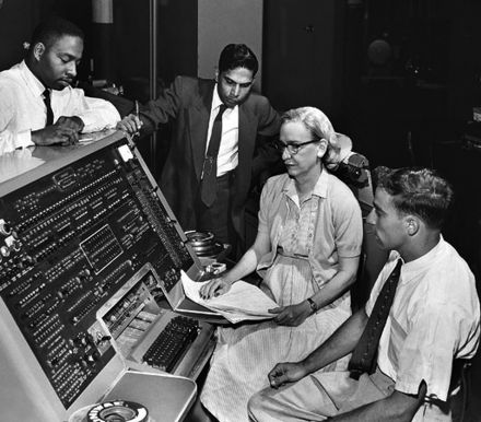 Grace Hopper and colleagues working at UNIVAC 1 console c. 1960